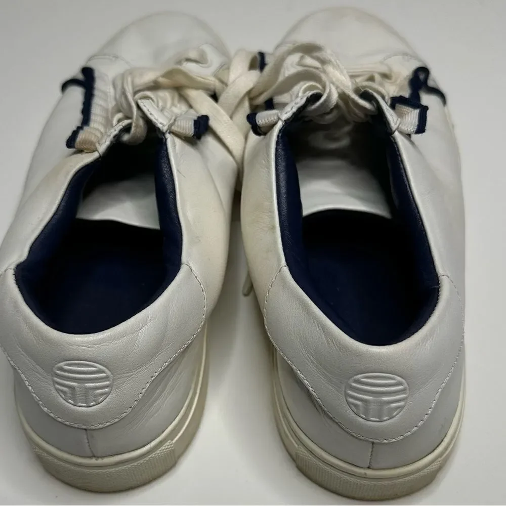 Tory Burch Ruffle sneakers. Size 10M. White with elegant‎ black ruffle.
